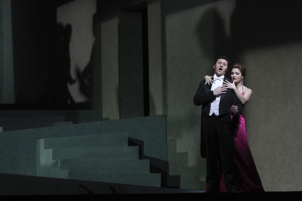 In this Friday, March 23 2012 photo, Anna Netrebko performs the title role alongside Piotr Beczala as Chevalier des Grieux, during the final dress rehearsal of Jules Massenet's "Manon," at the Metropolitan Opera in New York. (AP Photo/Mary Altaffer)