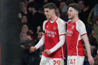 Arsenal's Kai Havertz, left, celebrates with Arsenal's Declan Rice after scoring his side's third goal during the English Premier League soccer match between Arsenal and Chelsea at Emirates Stadium in London, Tuesday, April 23, 2024. (AP Photo/Kin Cheung)