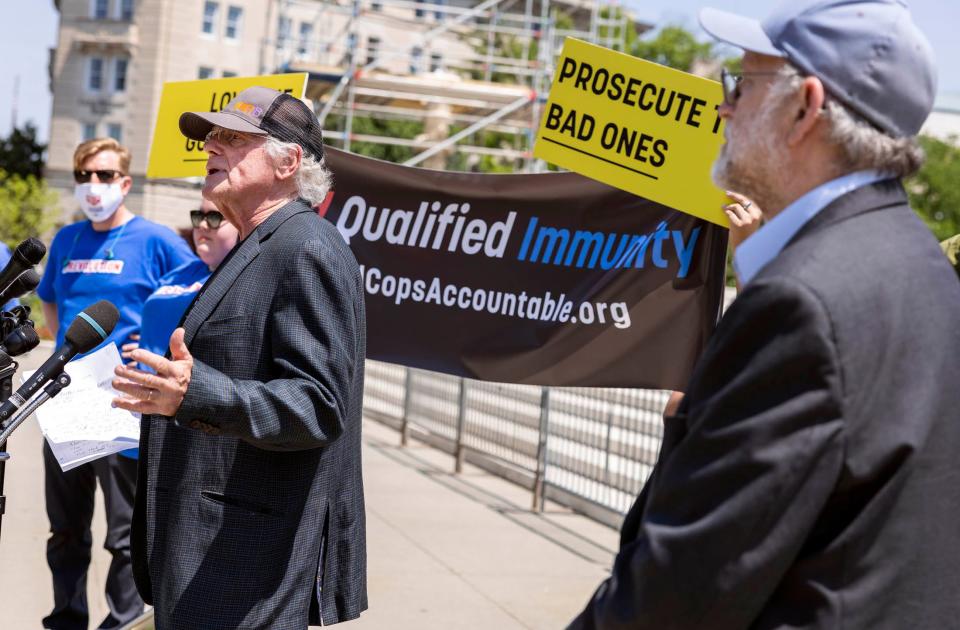 Ben Cohen, left, and Jerry Greenfield, the founders of Ben and Jerry's Ice Cream, speak at an event on police reform at the U.S. Supreme Court on May 20 in Washington, D.C. The two are urging the end of police qualified immunity.