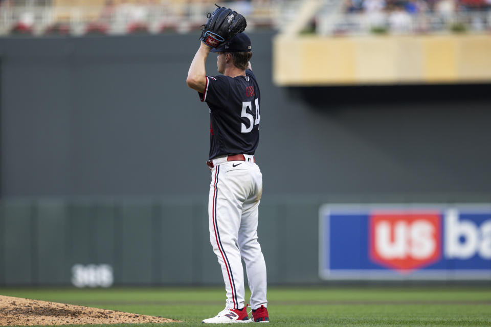 Minnesota Twins starting pitcher Sonny Gray pauses after giving up two-run single to Pittsburgh Pirates' Andrew McCutchen during the sixth inning of a baseball game Saturday, Aug. 19, 2023, in Minneapolis. (AP Photo/Bailey Hillesheim)