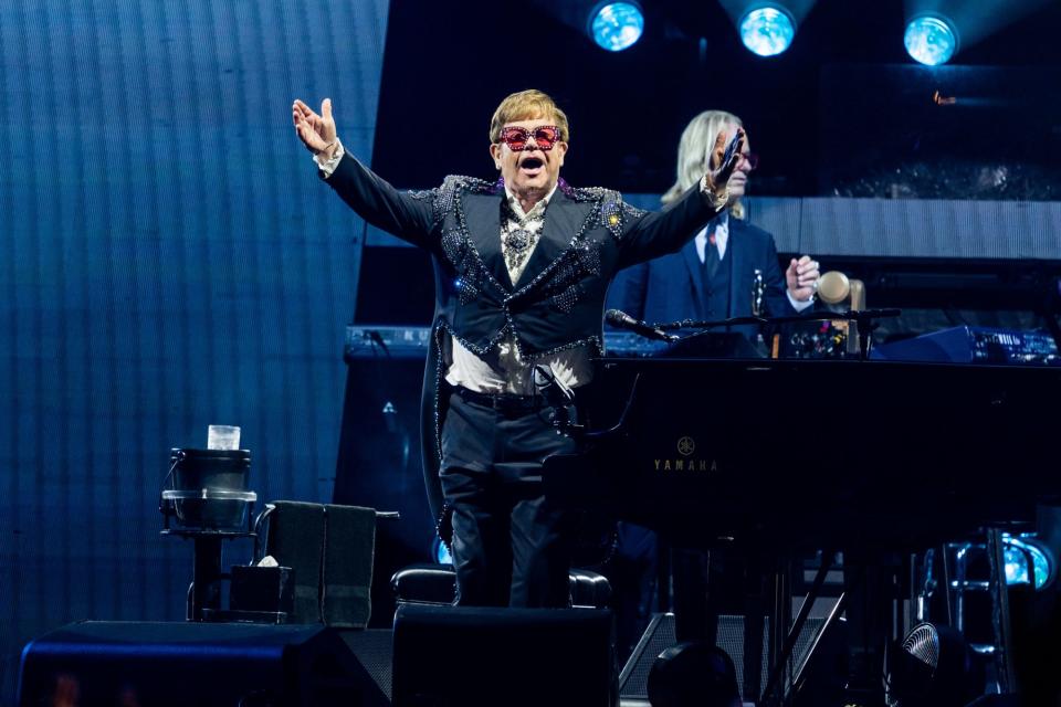 <p>Elton John performs for fans during a stop at Soldier Field in Chicago on Aug. 5.</p>