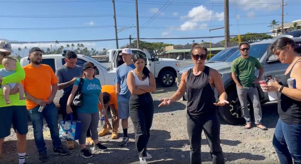 PHOTO: Tiare Lawrence speaks to volunteers leading a caravan to distribute goods to the areas damaged by Lāhainā wildfire. (ABC News)