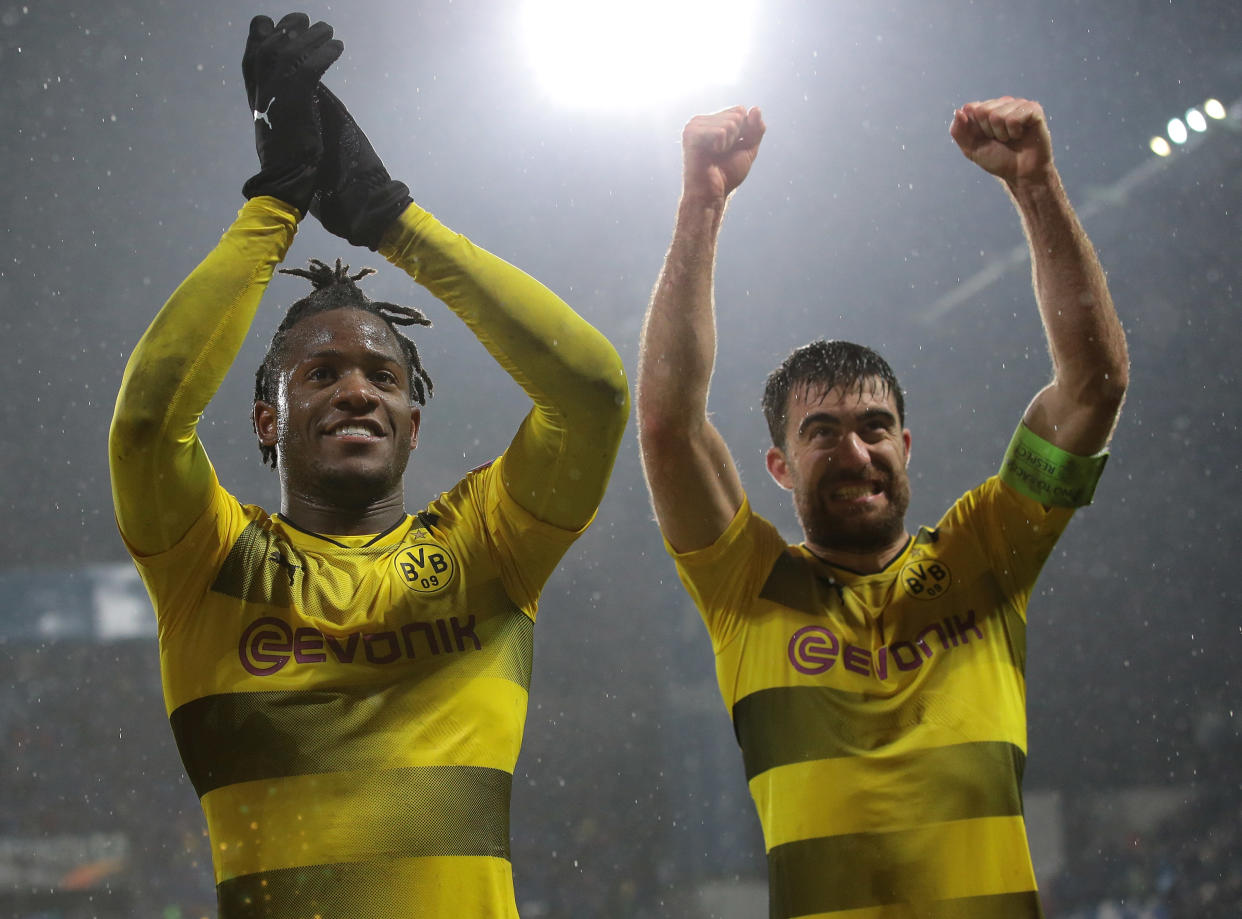 Borussia Dortmund’s Michy Batshuayi and Sokratis Papastathopoulos celebrate Dortmund’s progression to the Europa League round of 16. (Getty)