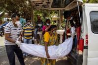 A Picture and its Story: Witnessing COVID chaos in India's hospitals, graveyards and crematoriums