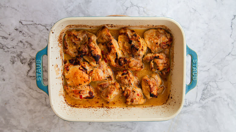Cooked chicken in blue baking dish