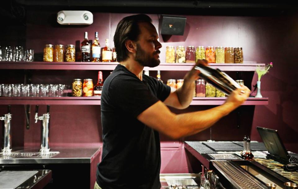 Sean Umstead of Kingfisher Bar mixes a Bee Durham cocktail on Tuesday, July 30, 2019. Umstead plans to bring farm to cocktail to the downtown Durham cocktail bar.