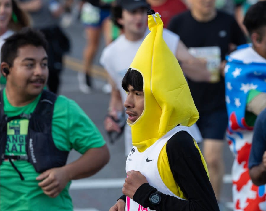 LOS ANGELES, CA MARCH 17: A runner sports interesting headgear during the LA Marathon on Sunday, March 17, 2024. Over 25,000 runners competed this year. (Myung J. Chun / Los Angeles Times via Getty Images)