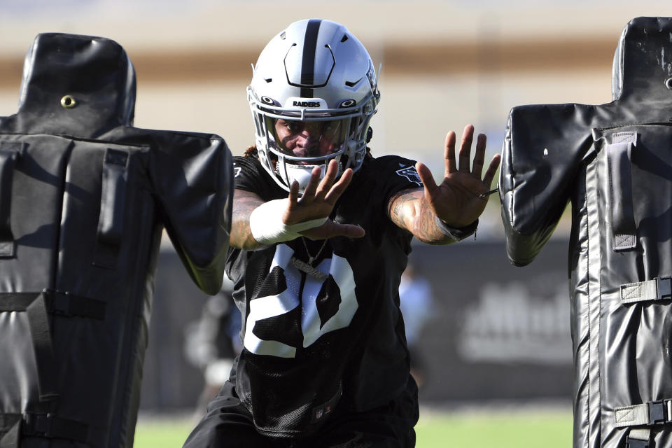 Las Vegas Raiders corner back Damon Arnette performs drills during an NFL football practice Wednesday, July 28, 2021, in Henderson. (AP Photo/David Becker)