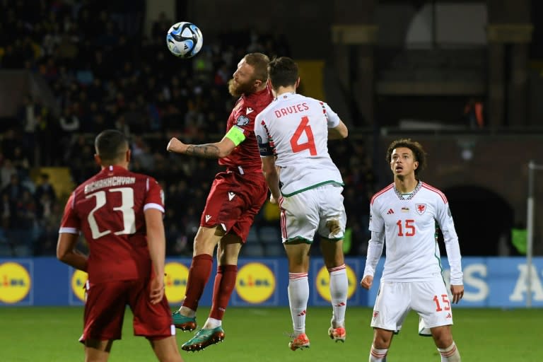 Armenia's Varazdat Haroyan (C-L) and Wales' Ben Davies (C-R)battle for the ball during their Euro 2024 qualifier (KAREN MINASYAN)