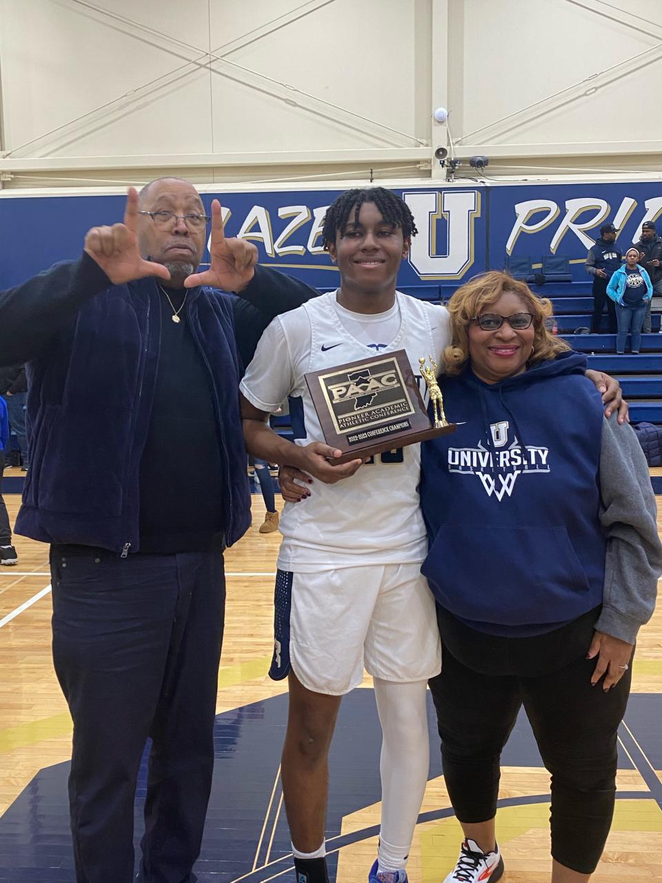 Sabien with mother Vivian and Anthony Carpenter, who has became a male role model in his life