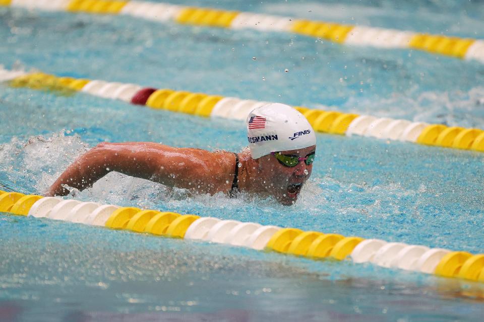 Mallory Weggemann quickly swims in a pool, competing in the Women's 50m Butterfly at the 2021 US Paralympic Swimming Trials.