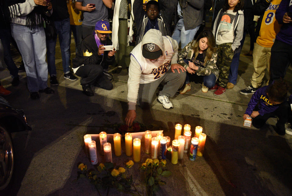 LOS ANGELES, CALIFORNIA - JANUARY 26: Los Angeles Lakers fans gather to pay respects at a vigil for the late NBA star Kobe Bryant on January 26, 2020 in Los Angeles, California. (Photo by Michael Tullberg/Getty Images)