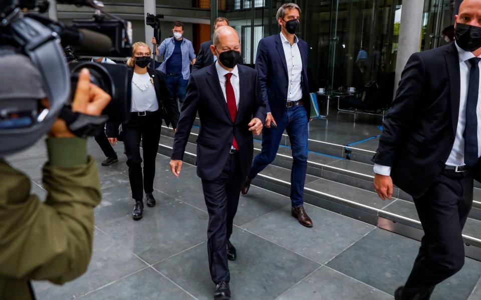 German Finance Minister and SPD candidate for the Chancellery Olaf Scholz leaves a Finance commission of inquiry at the German Parliament or Bundestag in Berlin, Germany, September 20, 2021. REUTERS/Michele Tantussi - MICHELE TANTUSSI/REUTERS