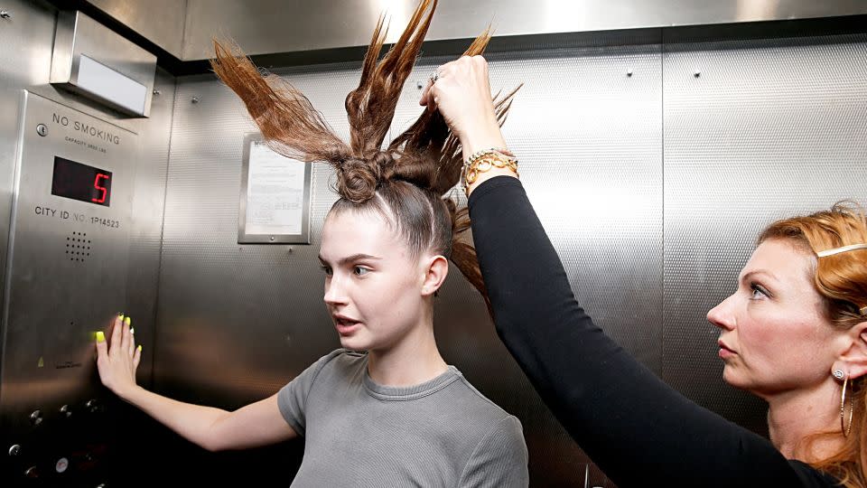 A model in the elevator at Anna Delvey's building on the Lowest East Side. - Dominik Bindl/Getty Images