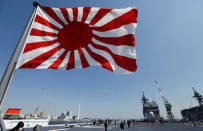 Japan's naval flag is seen on the Japan Maritime Self-Defense Force's (JMSDF) latest Izumo-class helicopter carrier DDH-184 Kaga after a handover ceremony for the JMSDF by Japan Marine United Corporation in Yokohama, Japan, March 22, 2017. REUTERS/Toru Hanai