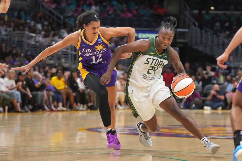 Jul 16, 2024; Los Angeles, California, USA; Seattle Storm guard Jewell Loyd (24) dribbles the ball against LA Sparks guard Rae Burrell (12) in the second half at Crypto.com Arena. Mandatory Credit: Kirby Lee-USA TODAY Sports