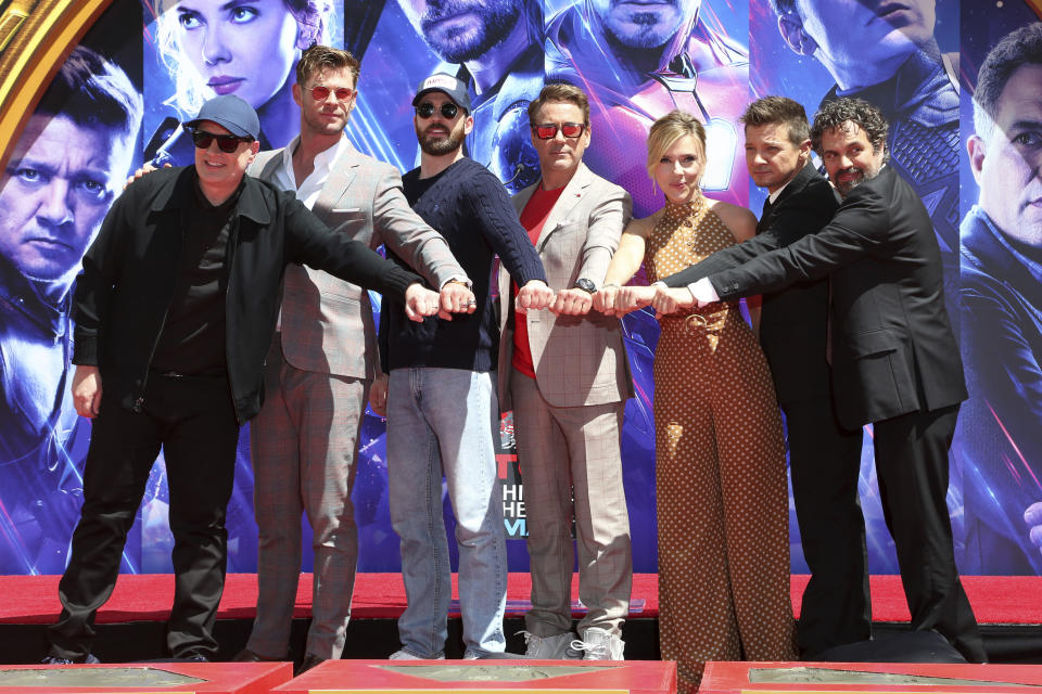 Marvel Studios President Kevin Feige, from left, poses with members of the cast of "Avengers: End Game," Chris Hemsworth, Chris Evans, Robert Downey Jr., Scarlett Johansson, Jeremy Renner and Mark Ruffalo at a hand and footprint ceremony at the TCL Chinese Theatre on Tuesday, April 23, 2019, in Los Angeles. (Photo by Willy Sanjuan/Invision/AP)