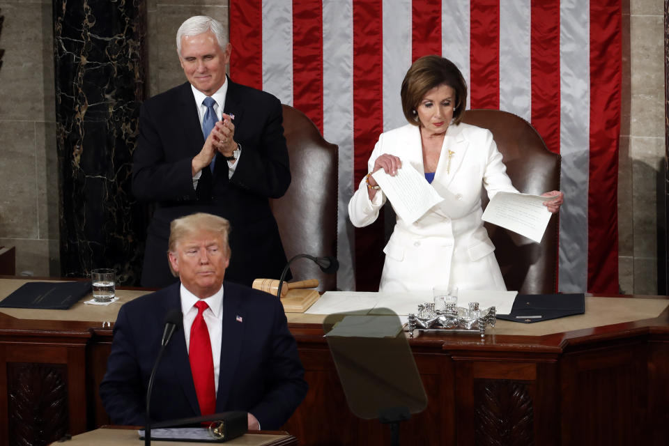 House Speaker Nancy Pelosi of Calif., tears her copy of President Donald Trump's s State of the Union address after he delivered it to a joint session of Congress on Capitol Hill in Washington, Tuesday, Feb. 4, 2020. Vice President Mike Pence is at left. (AP Photo/Alex Brandon)