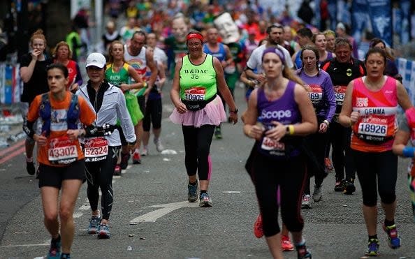 Runners at the 2015 London Marathon - Credit: Alan Crowhurst/Getty