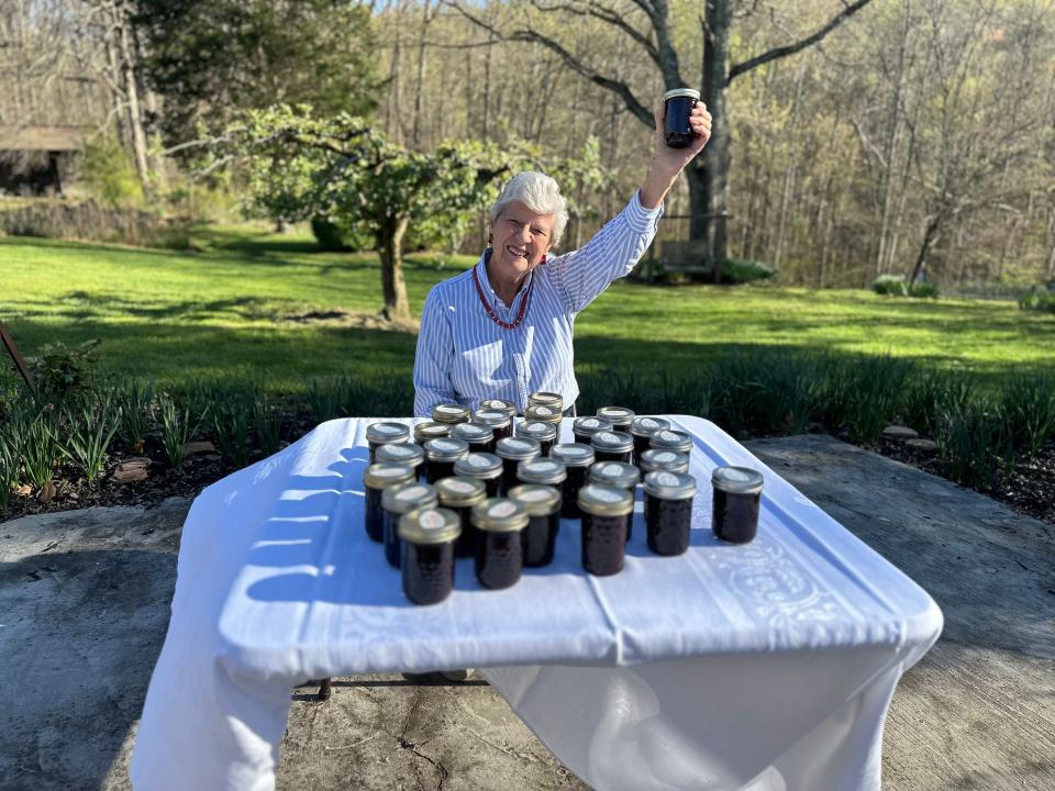 Martha Fisher shows off her blackberry jam that caused the summer festival to be named Blackberry Festival.