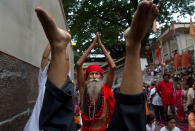 <p>An Indian Sadhu or Hindu holy man performs Yoga as others follow during the International Yoga Day at Kamakhya temple in Gauhati, India, Wednesday, June 21, 2017. (Photo: Anupam Nath/AP) </p>