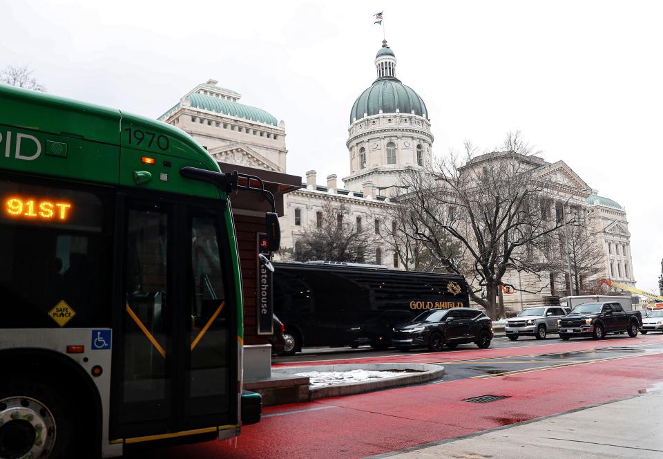 Passengers board the IndyGo Red Line on Capitol Avenue, Indianapolis, Thursday, Feb. 6, 2020.