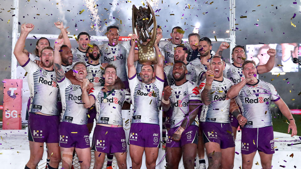 Pictured here, Melbourne Storm players hoist the 2020 NRL premiership trophy aloft. 
