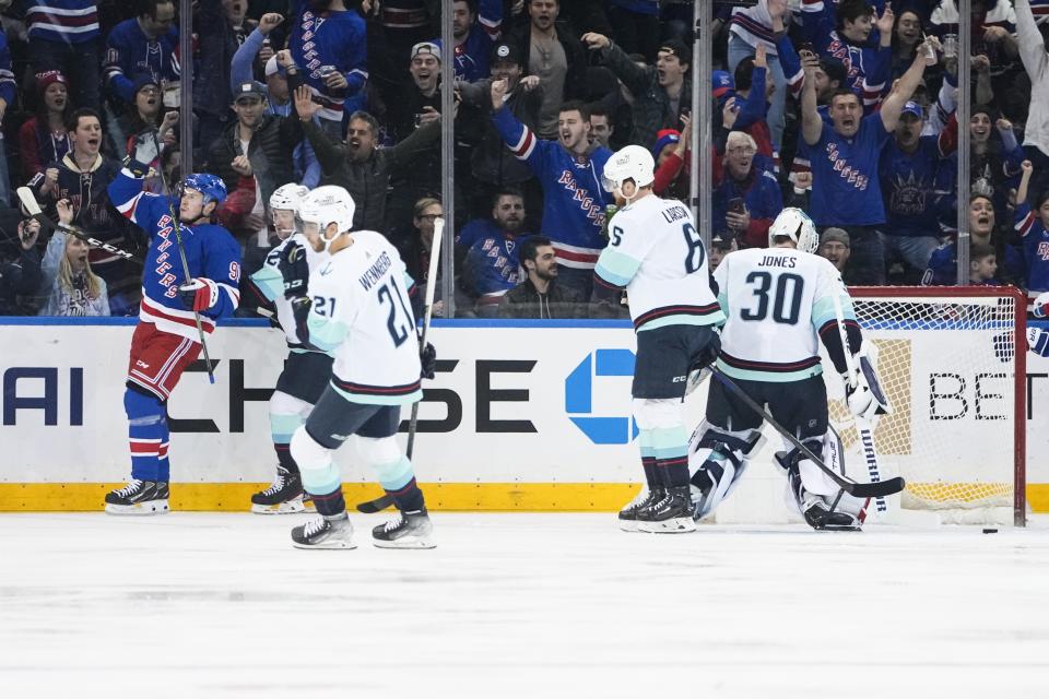 New York Rangers' Vladimir Tarasenko, left, celebrates after scoring as Seattle Kraken's Martin Jones (30), Alex Wennberg (21) and Adam Larsson (6) react during the first period of an NHL hockey game Friday, Feb. 10, 2023, in New York. (AP Photo/Frank Franklin II)