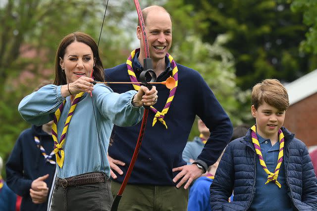 <p>Daniel Leal/Getty</p> From left: Kate Middleton, Prince William and Prince George at the Big Help Out on May 8, 2023