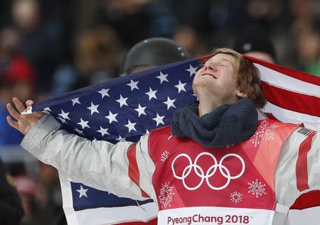 Snowboarding - Pyeongchang 2018 Winter Olympics - Men's Big Air Finals - Alpensia Ski Jumping Centre - Pyeongchang, South Korea - February 24, 2018 - Kyle Mack of the U.S. celebrates with his national flag. REUTERS/Murad Sezer