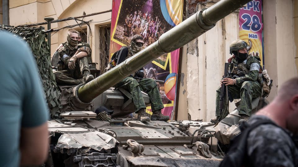 Members of Wagner group sit atop of a tank in a street in the city of Rostov-on-Don, on June 24, 2023.  - Roman Romokhov/AFP/Getty Images