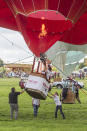 <p>Hot air Balloons are being tethered as balloonists prepare to launch at the Bristol international balloon fiesta held on August 10, 2017 in Avon, England. (Photo: Amer Ghazzal/Barcroft Images) </p>