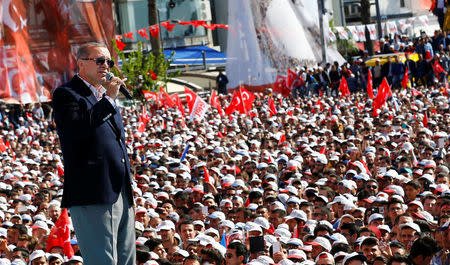 FILE PHOTO: Turkish President Tayyip Erdogan addresses his supporters during a rally for the upcoming referendum, in Izmir, Turkey, April 9, 2017. REUTERS/Umit Bektas