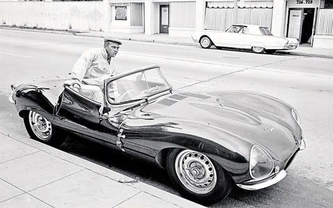 Steve McQueen gets into his Jaguar XKSS in Hollywood in June 1963 - Credit: John Dominis/Time & Life Pictures/Getty Images