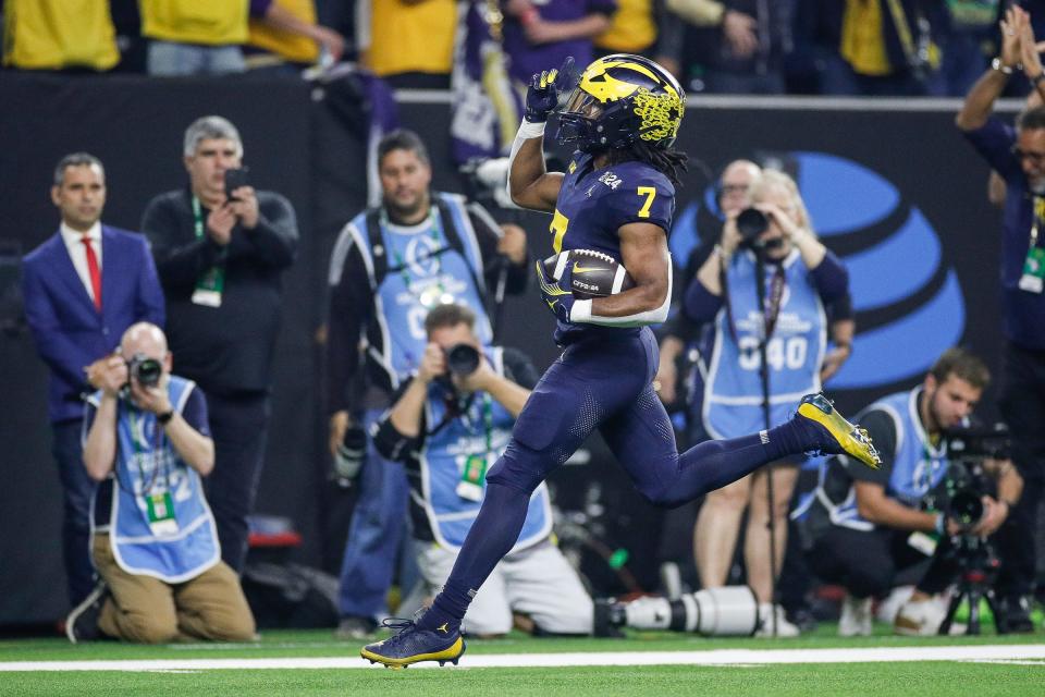 Michigan running back Donovan Edwards runs for a touchdown against Washington during the first half of the national championship game at NRG Stadium in Houston, Texas on Monday, Jan. 8, 2024.