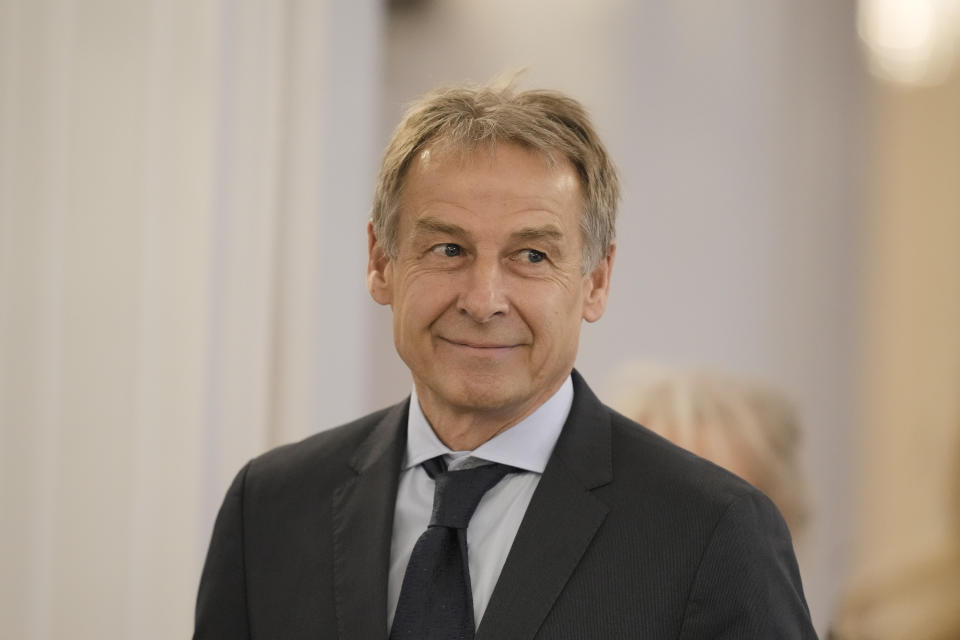 German former soccer player and national team coach Juergen Klinsmann arrives for a reception to honor former Chancellor Angela Merkel with the Grand Cross of the Order of Merit of the Federal Republic of Germany in a special design at Bellevue Palace in Berlin, Germany, Monday, April 17, 2023. (AP Photo/Markus Schreiber)