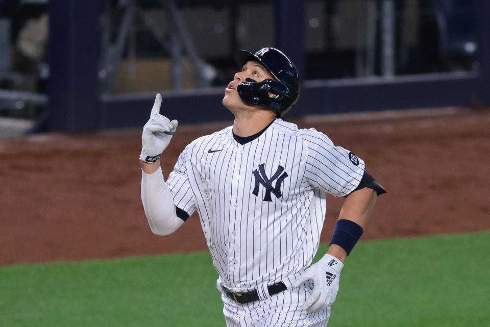 Yankees right fielder Aaron Judge celebrates after hitting a home run during the third inning at Yankee Stadium on Friday, April 30, 2021.