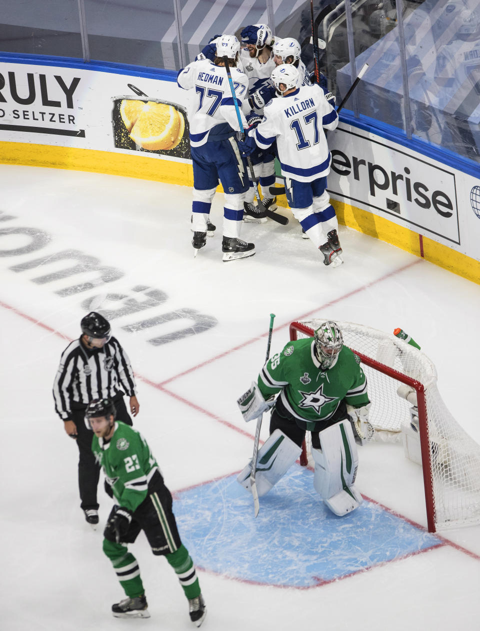 Tampa Bay Lightning center Brayden Point (21) celebrates his goal against Dallas Stars goaltender Anton Khudobin (35) with teammates during the second period of Game 4 of the NHL hockey Stanley Cup Final, Friday, Sept. 25, 2020, in Edmonton, Alberta. (Jason Franson/The Canadian Press via AP)