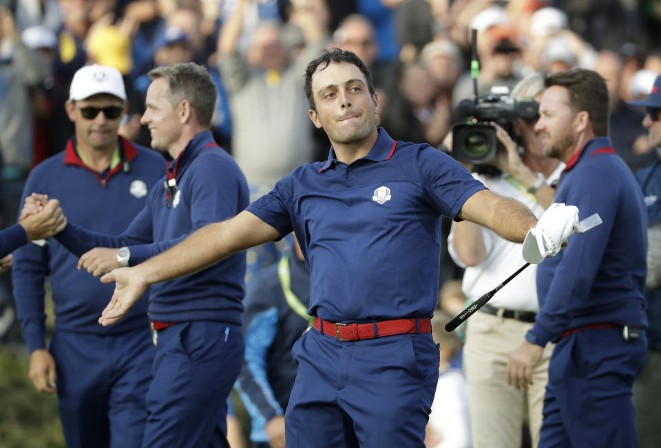 Europe's Francesco Molinari celebrates after winning a foursome match with his partner Tommy Fleetwood on the opening day of the 42nd Ryder Cup at Le Golf National in Saint-Quentin-en-Yvelines, outside Paris, France, Friday, Sept. 28, 2018. Molinari and Fleetwood beat Justin Thomas of the US and Jordan Spieth 5 and 4. (AP Photo/Matt Dunham)