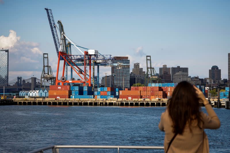 Shipping containers are stacked on a pier at the Red Hook Terminal in Brooklyn, New York