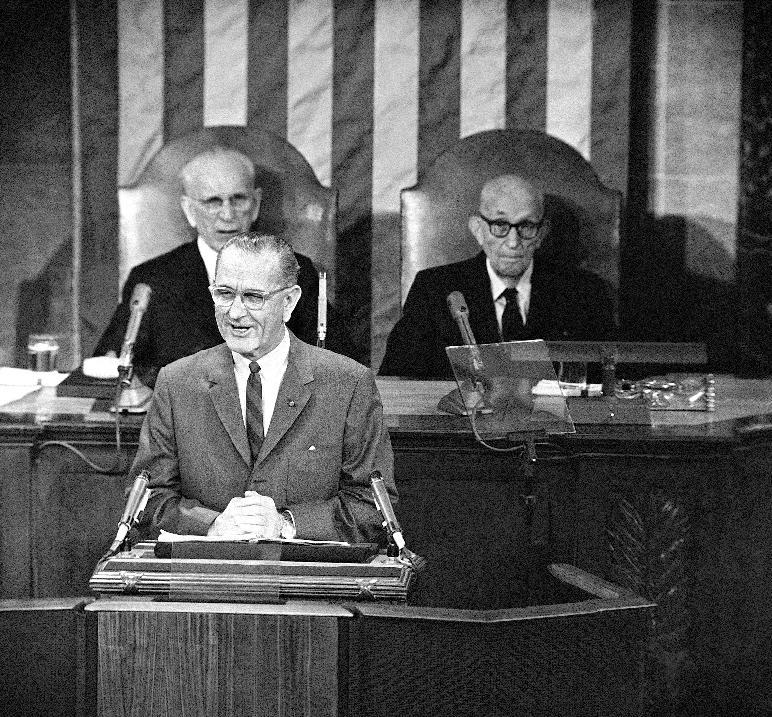 FILE - This Jan. 12, 1966 file photo shows President Lyndon Baines Johnson giving his State of the Union address on Capitol Hill in Washington. Is “strong” losing its strength? Presidents of both parties have long felt compelled to sum up the state of the union with a descriptive word or two in their State of the Union addresses. Mostly the same word. For many years now, “strong” has been the go-to adjective. House Speaker John McCormack of Mass. is at left, Sen. Carl Hayden, D-Ariz. is at right. (AP Photo, File)