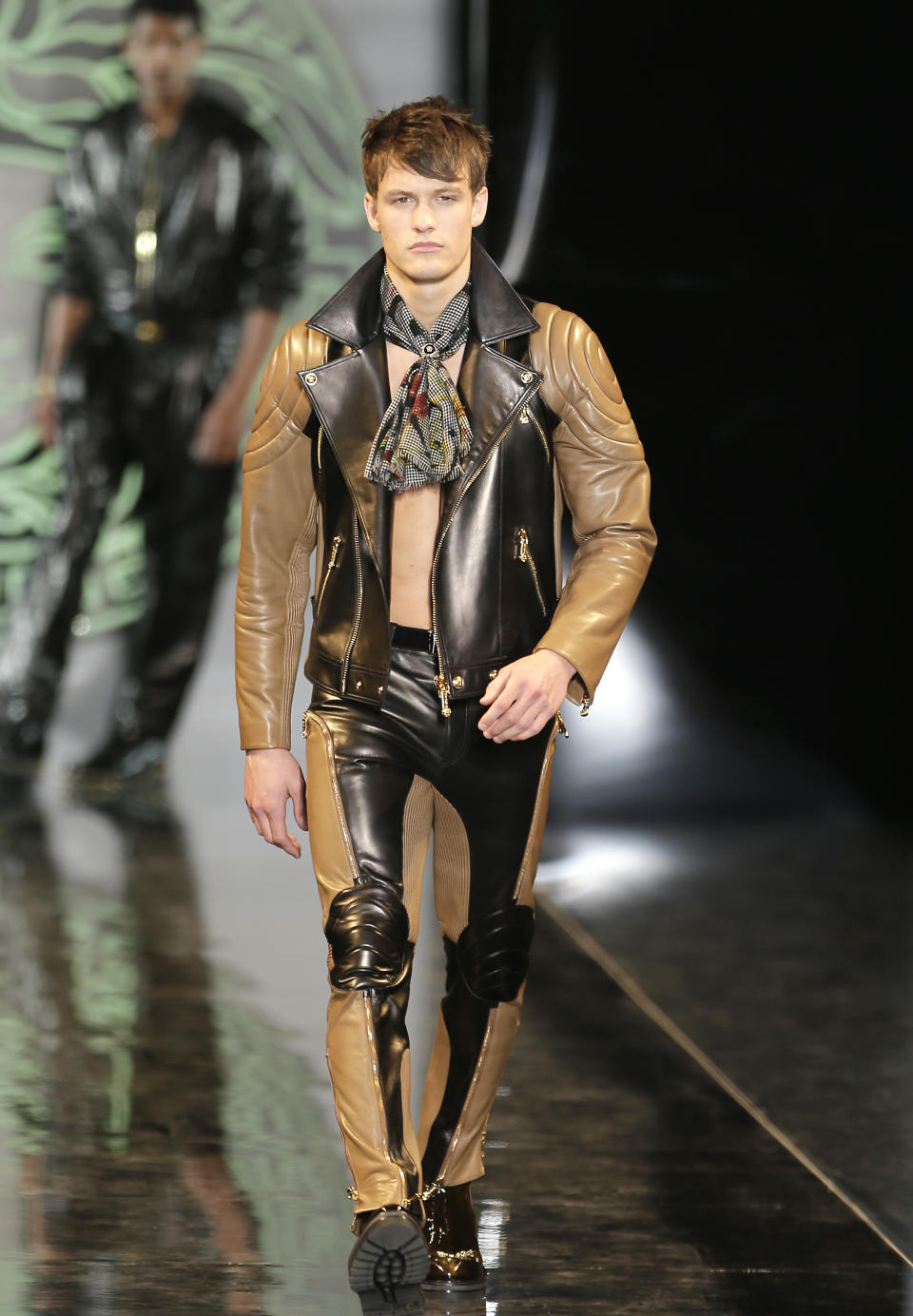 A model wears a creation of Versace men's Fall-Winter 2013-14 collection, part of the Milan Fashion Week, unveiled in Milan, Italy, Saturday, Jan. 12, 2013. (AP Photo/Antonio Calanni)