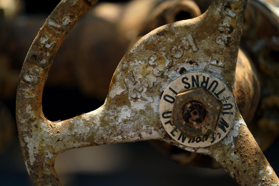 An equipment valve handle is seen at a site on the Rooke family ranch where an orphaned oil well is being plugged, Tuesday, May 18, 2021, near Refugio, Texas. There are 3.2 million abandoned oil and gas wells in the U.S., according to the Environmental Protection Agency. About a third were plugged with cement, which is considered the proper way to prevent harmful chemical leaks. But most, about 2.1 million by the EPA's count, haven't been plugged at all. (AP Photo/Eric Gay)