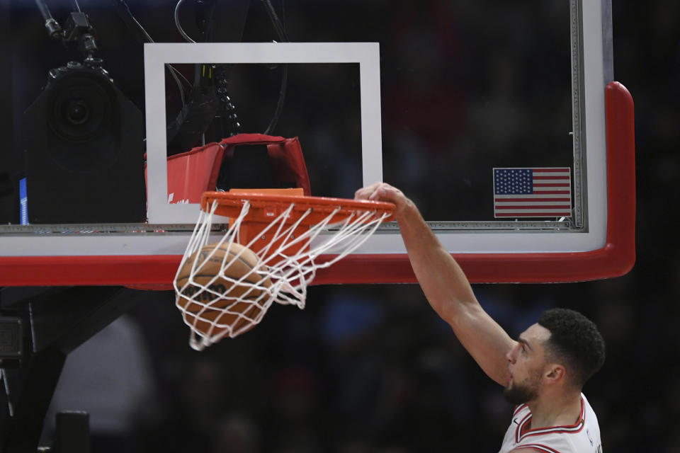 Chicago Bulls' Zach LaVine dunks against the Golden State Warriors during the second half of an NBA basketball game Friday, Jan 12, 2024, in Chicago. Golden State won 140-131. (AP Photo/Paul Beaty)