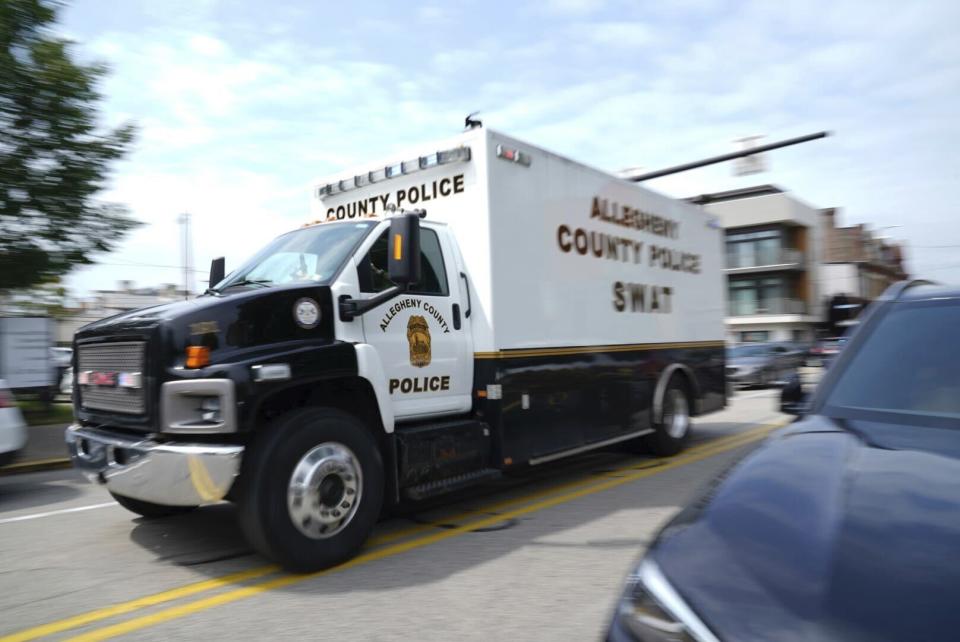 An Allegheny County Police SWAT vehicle responds to gunfire in the Garfield neighborhood of Pittsburgh on Wednesday, Aug. 23, 2023. (Benjamin B. Braun/Pittsburgh Post-Gazette via AP)