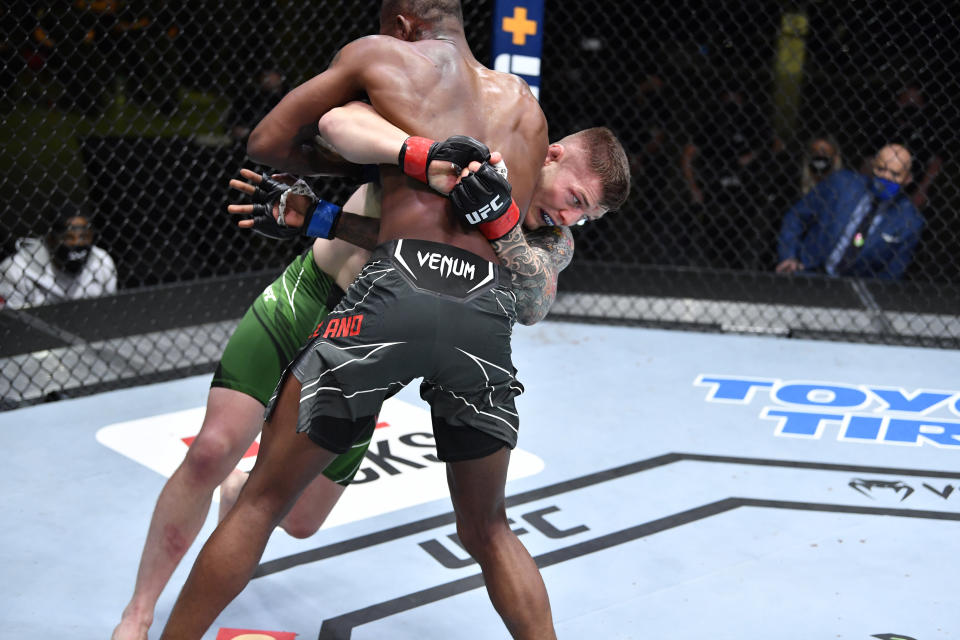 LAS VEGAS, NEVADA - APRIL 10: (L-R) Marvin Vettori of Italy takes down Kevin Holland in a middleweight fight during the UFC Fight Night event at UFC APEX on April 10, 2021 in Las Vegas, Nevada. (Photo by Chris Unger/Zuffa LLC)