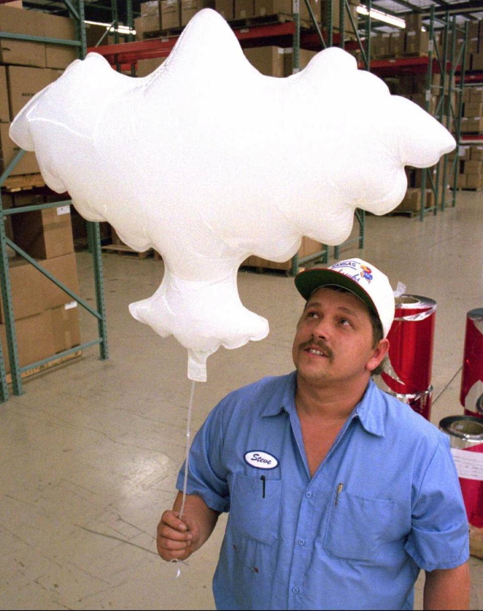 In this 1994 photo, Pioneer Balloon production manager Steve Wilson held one of the balloon doves the company made for the closing ceremonies of the Winter Olympics in Lillehammer, Norway.