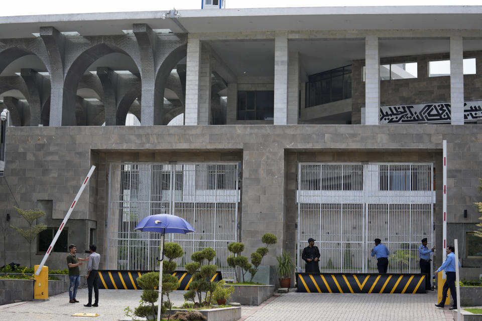 Police officers stand guard outside the Islamabad High Court in Islamabad, Pakistan, Thursday, Aug. 24, 2023. A court in Pakistan's capital is likely to issue a crucial ruling Thursday on an appeal from the country's imprisoned former Prime Minister Imran Khan against his recent conviction and three-year sentence in a graft case, one of his lawyers said. (AP Photo/Anjum Naveed)