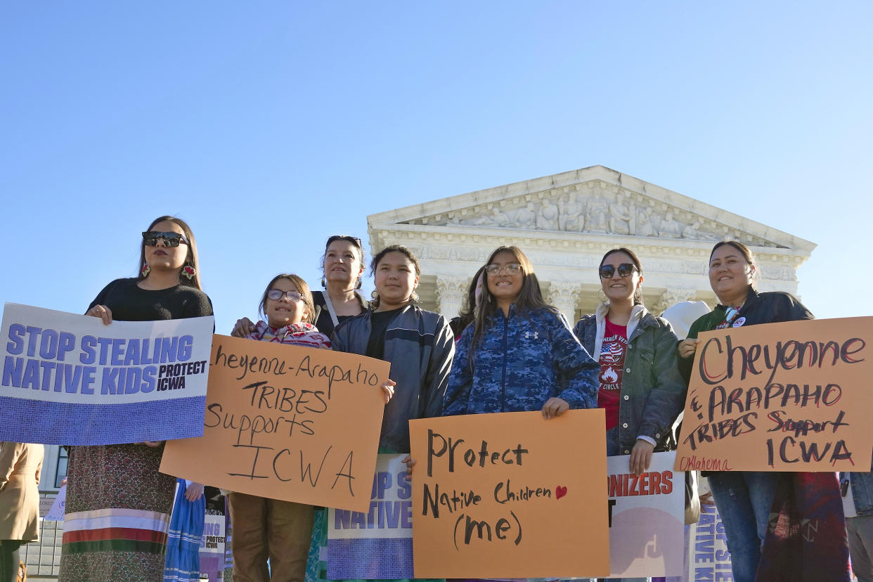 Demonstrators stand outside of the U.S. Supreme Court, as the court hears arguments over the Indian Child Welfare Act (Mariam Zuhaib / AP file )