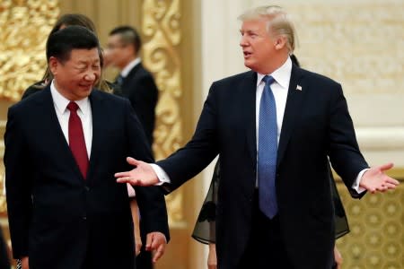 U.S. President Trump and China's President Xi Jinping arrive for a state dinner at the Great Hall of the People in Beijing